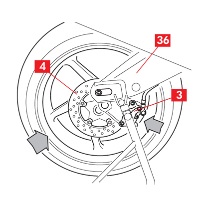 The wheel is inserted into the swingarm and the chain is repositioned on the ring gear.