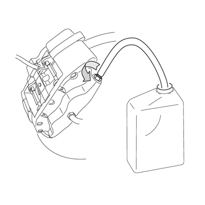 The bleeder plug on the caliper is opened and the liquid begins to collect in a container.