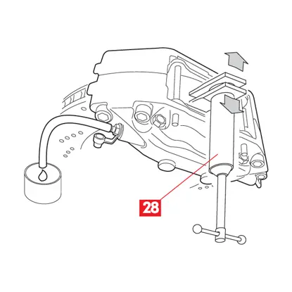 A spreader is used to push the pistons into the brake caliper.